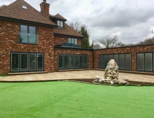 Large installation of black bifold doors