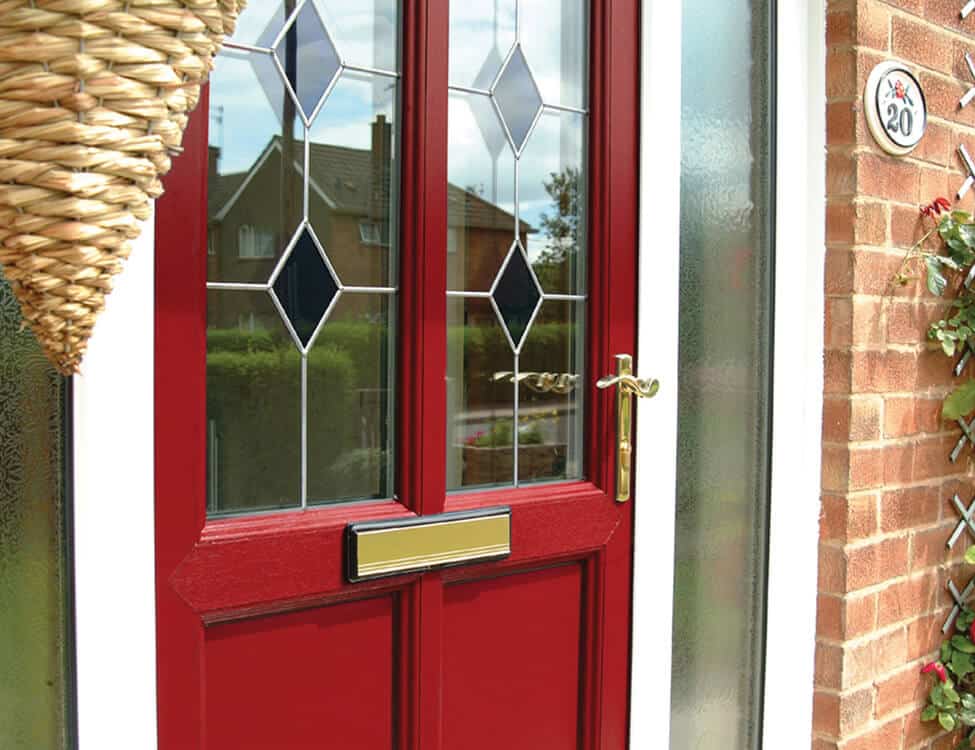 Red uPVC front door with gold hardware