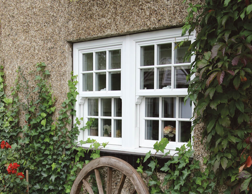 Traditional white uPVC vertical sliding windows