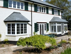 Two white aluminium bay windows