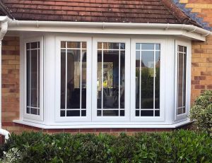 White uPVC bay window with astragal bars